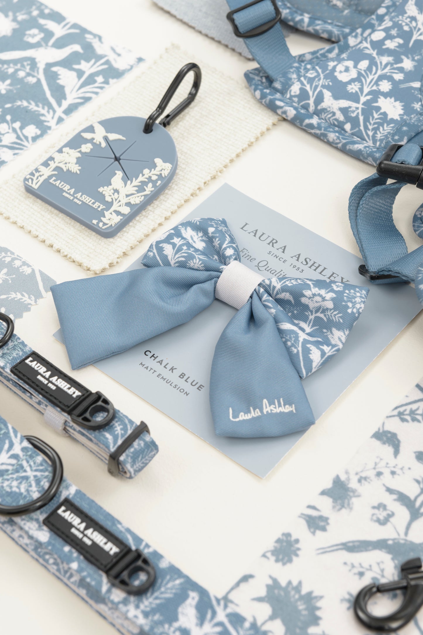Blue and white dog collar and bow tie with Laura Ashley Shepherd's Purse floral design on a collage of Laura Ashley fabric and paint colour samples