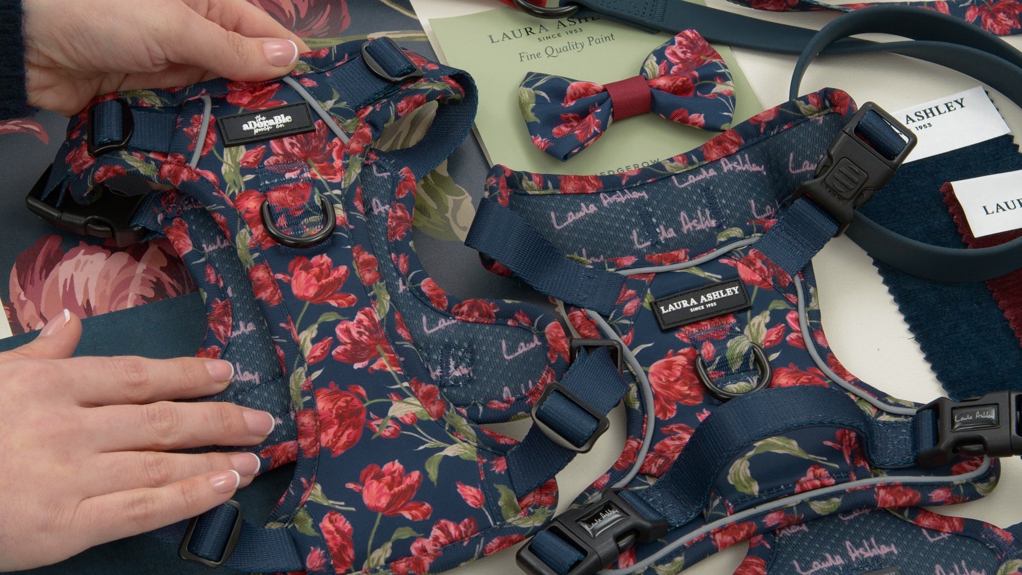 Dog accessories with floral pattern on a white surface