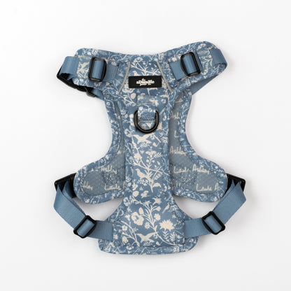 Dog harness with blue and white floral pattern on a white background