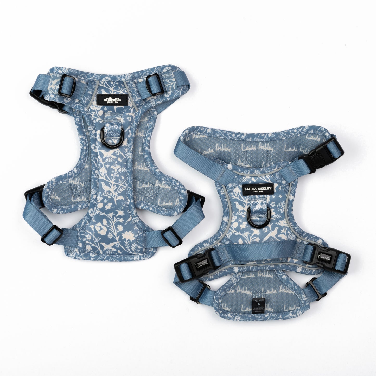 Two floral-patterned dog harnesses on a white background