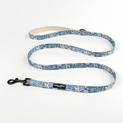 Dog lead with blue and white floral pattern on a white background with Laura Ashley branding and black hardware