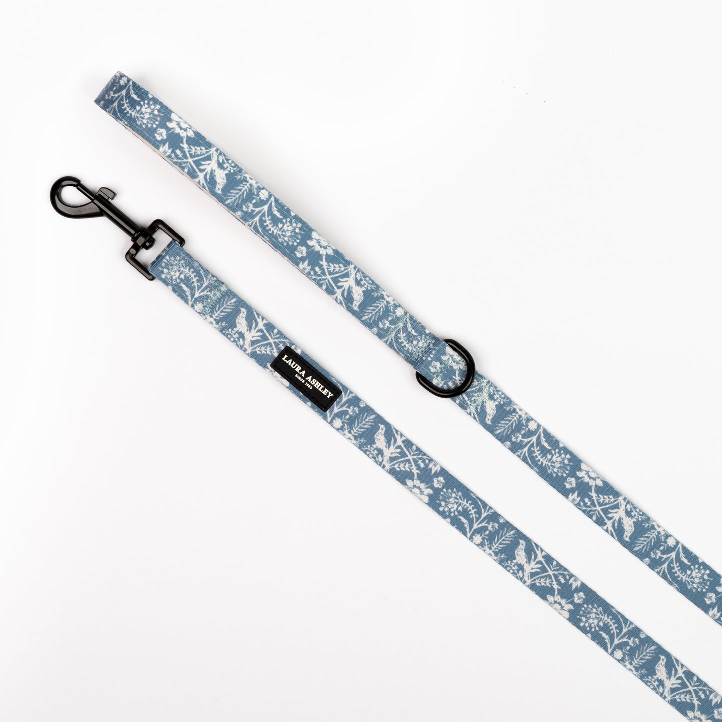 Dog leash with floral blue and white pattern on a white background