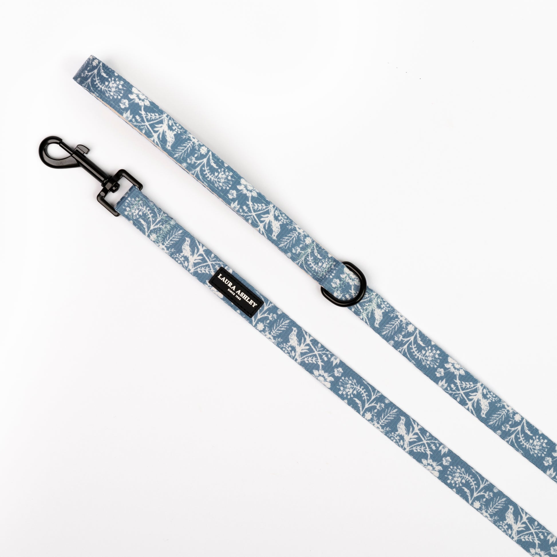 Dog leash with floral blue and white pattern on a white background
