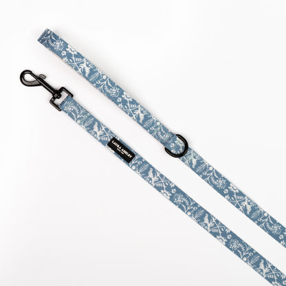 Dog leash with floral blue and white pattern on a white background