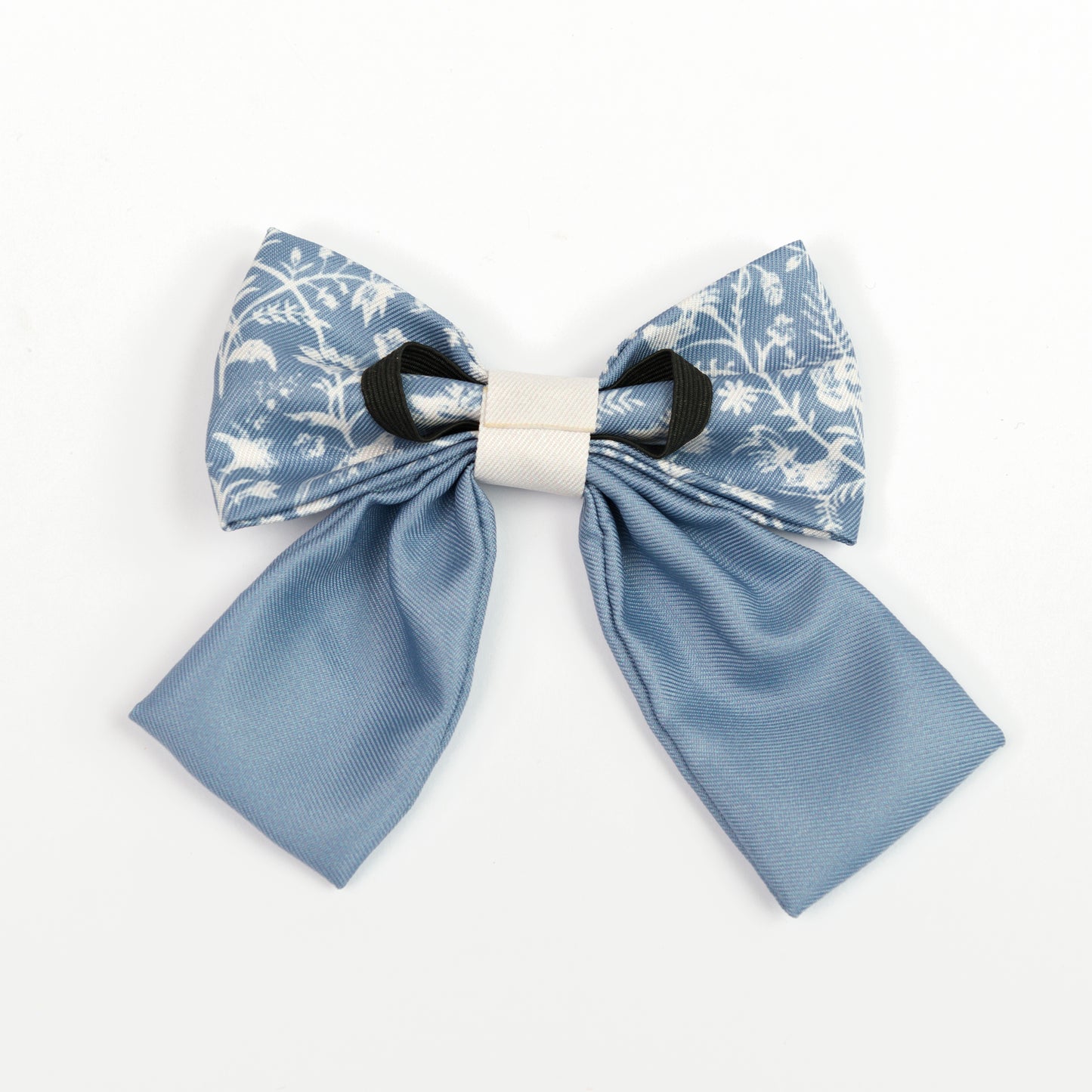 Blue and white floral sailor bow tie for dogs on a white background
