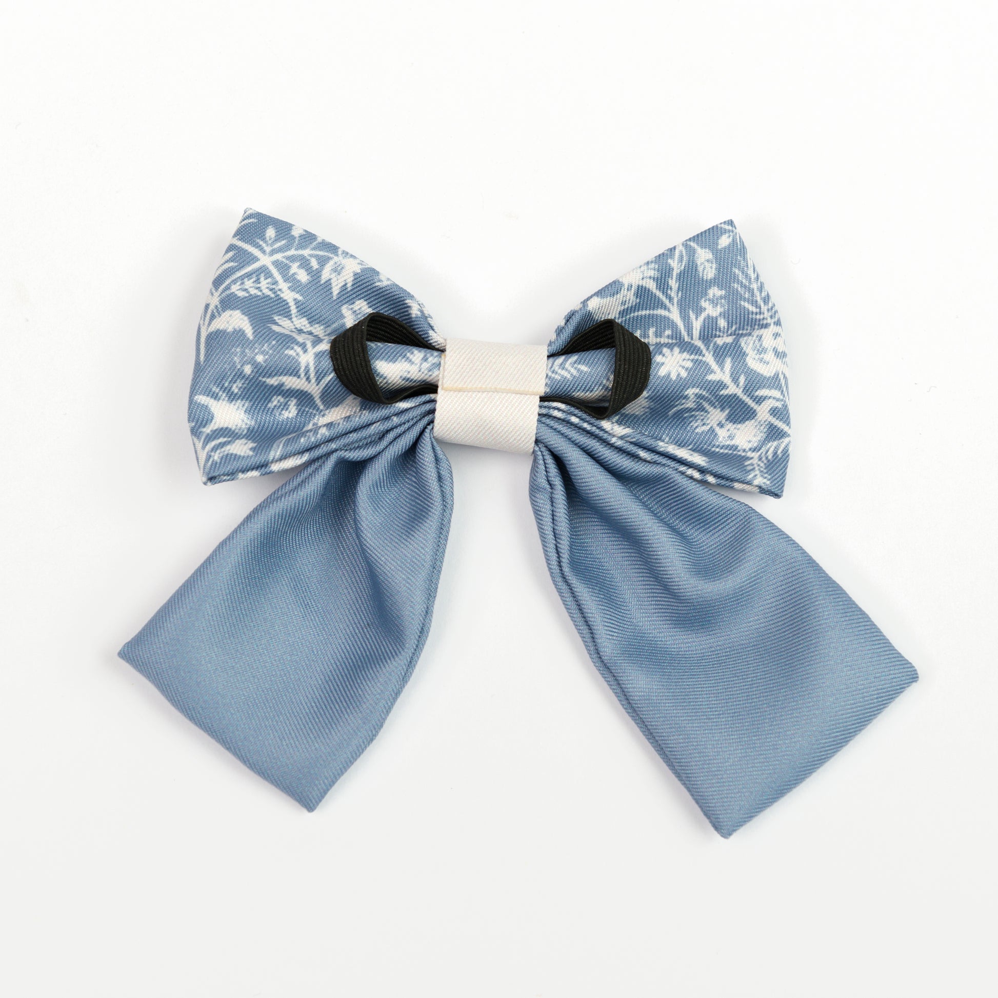 Blue and white floral sailor bow tie for dogs on a white background