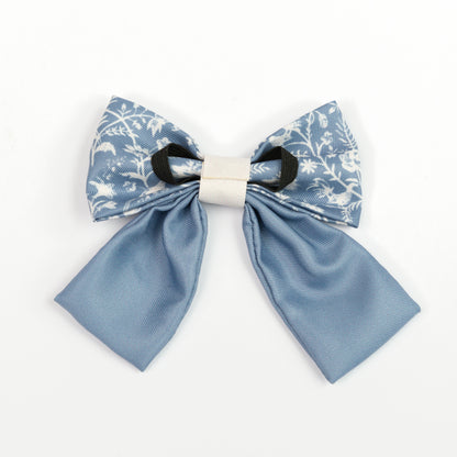 Blue and white floral sailor bow tie for dogs on a white background