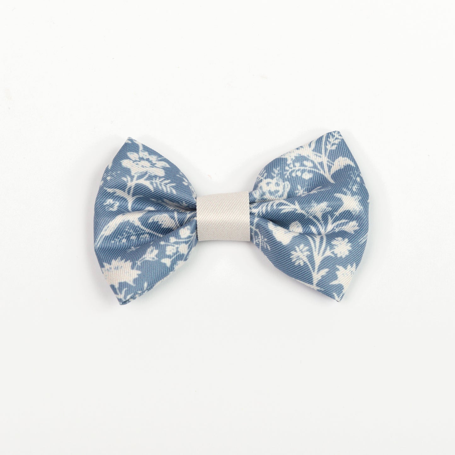 Blue and white floral bow tie on a white background