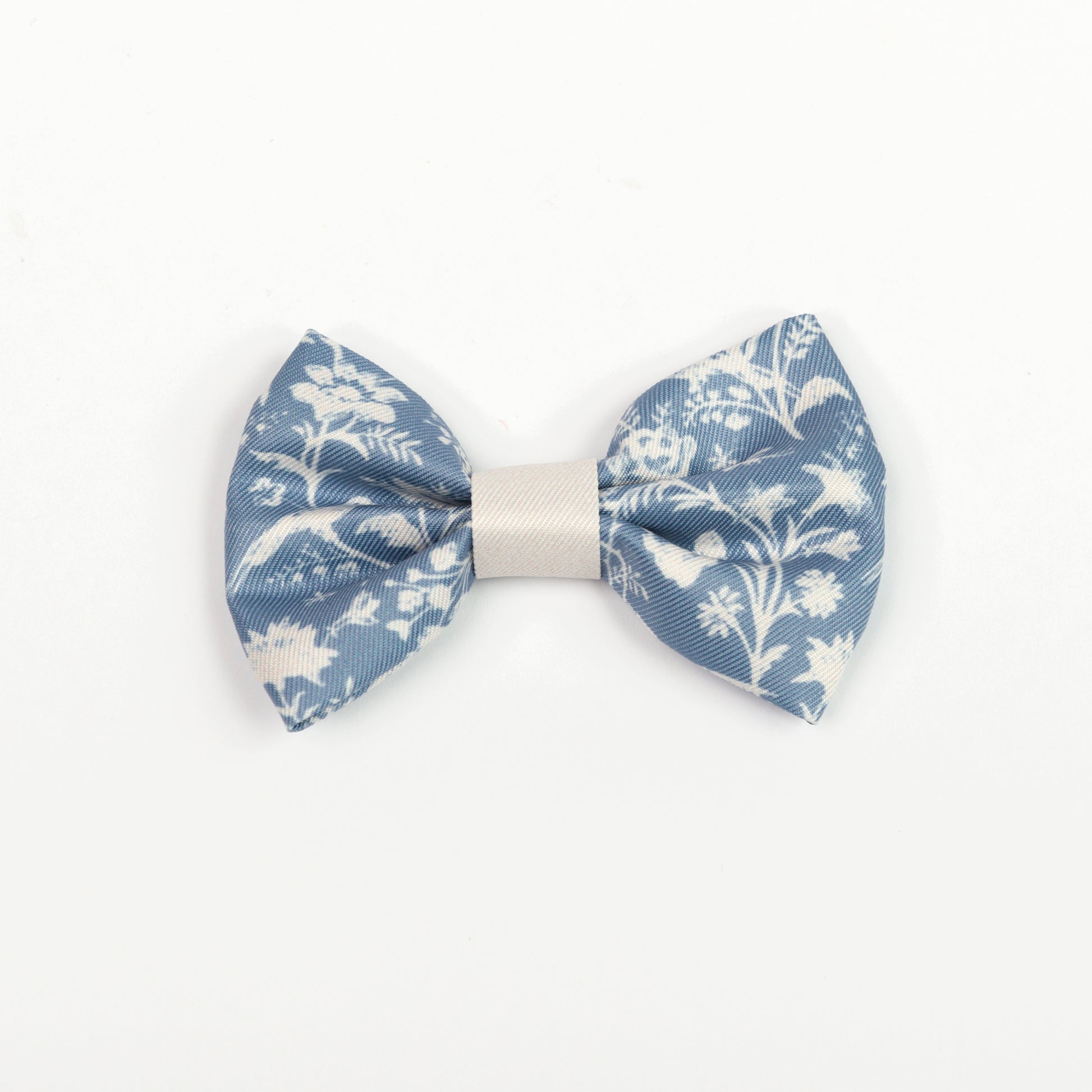Blue and white floral bow tie on a white background