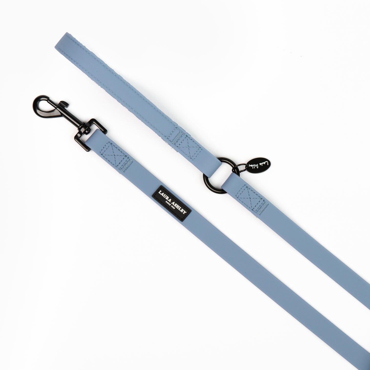 Powder blue dog lead with black hardware laid on a white background