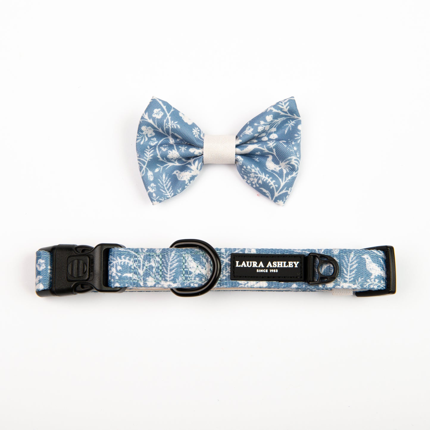 Dog collar and bow tie set with floral pattern on a white background, featuring Laura Ashley branding.