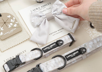 Dog harness and collar set with 'Laura Ashley' branding on a light background.