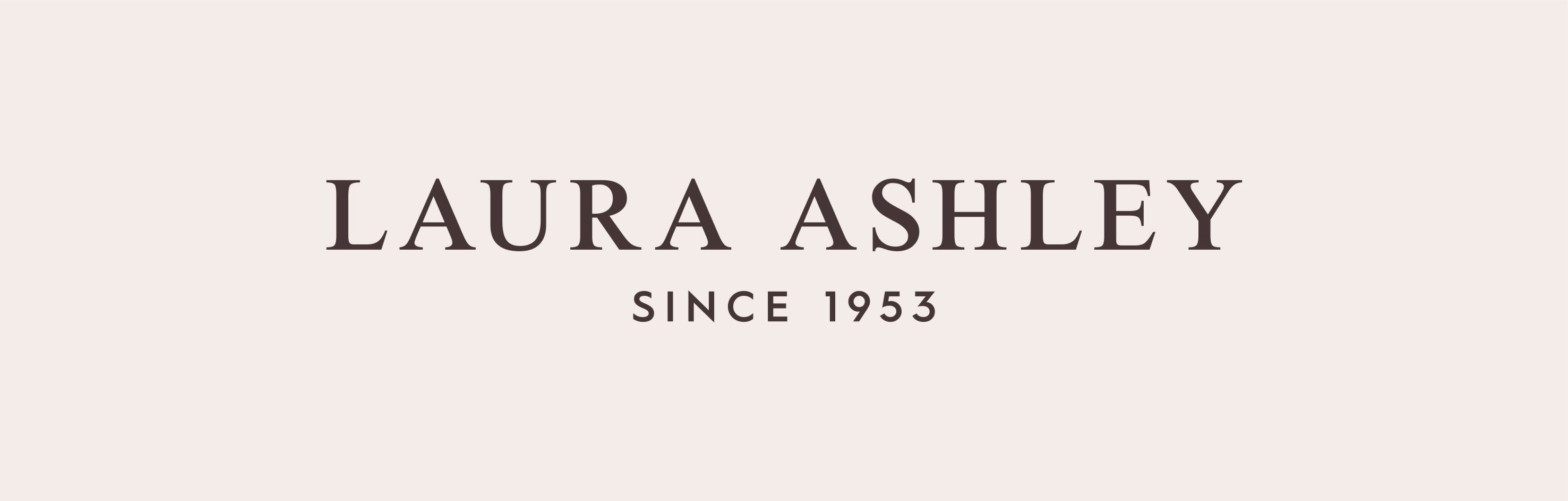 Laura Ashley logo on a beige background