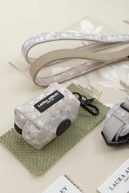Dog lead and dog waste bag dispenser in Magnolia Grove Laura Ashley branding on a light background