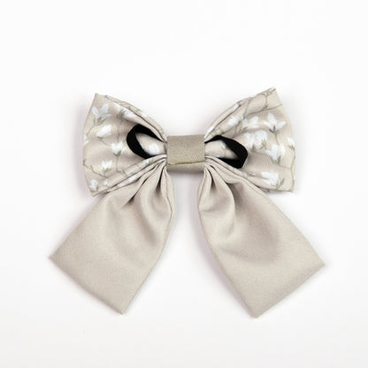 Beige dog sailor bow tie on a white background